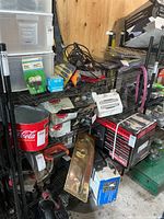 Overall view of black metal wire shelving unit loaded with assorted items (not included)