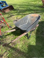 Full view of wheelbarrow showing tub, handles, frame