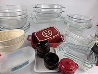 Group view of all bakeware including Emile Henry baker, Pyrex dishes, bannetons, Federal Glass pan, mini cocotte, ramekins, mixing bowls