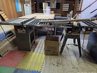 Wide view of Craftsman contractor table saw with extension wings and stand