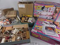 Overall lot showing two boxed playsets, trays and bags of accessories
