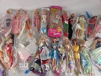 Full layout of all dolls including boxed Holiday Treats Barbie and loose dolls in plastic sleeves