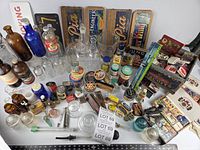 Overall view of all bottles, tins, glassware and advertising pieces