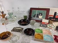 Overview of glassware, ashtrays, Bohemia coasters, Pimpernel items, Carlsberg sign