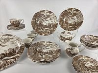 Full group of plates, cups, creamer and sugar