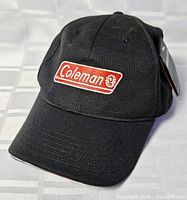 Full view of black Coleman baseball cap front and top