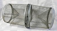 Side view showing full cylindrical trap and center latch