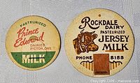 Front view of both milk bottle caps showing graphics and text