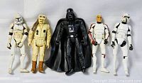 Front view of five Star Wars action figures standing side by side