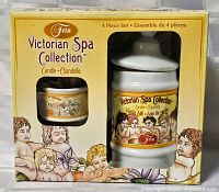 Front view of boxed Fern Victorian Spa Collection candle set showing jar and small candle through window