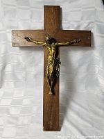 Front view of wooden crucifix showing full cross and corpus