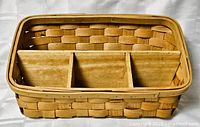 Top view of rectangular woven wood organizer showing three compartments