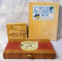 Full lot: book, CD wooden box, cheese knife set closed