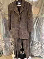 Full view of blazer and pants on hanger