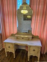 Front view of cream painted French Provincial dressing table with attached mirror