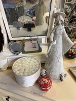 Full grouping showing angel, dishes, boxes and figurines