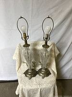 Pair of clear glass lamps full view front
