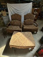View of both armchairs and ottoman together