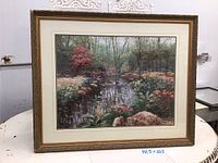 Full view of framed landscape painting