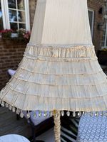 Tiered cream silk lampshade detail