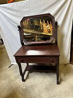 front view of vanity table with attached swivel mirror