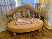 Full view of settee front with wood frame and upholstery