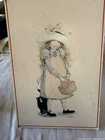 Full view of plaque showing entire Holly Hobbie illustration and red border