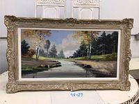Full view of framed oil painting showing size notation 48x29