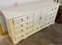 Front angled view showing dresser drawers, cabinet, hardware and left side measurements