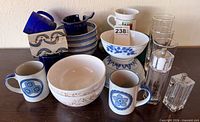 Group shot showing mugs, bowls, tumblers and grinders