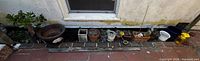 Wide view of entire row of planters against wall
