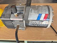 Side view of Campbell Hausfeld PowerPal compressor showing label, regulator and hose connection