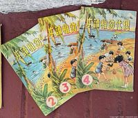 Front covers showing volumes 2-4 beach scene art and numbering