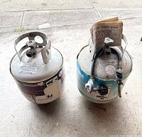 Both propane cylinders side by side showing overall condition and labeling