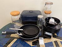 Group shot showing roaster, frying pans, plate stack, jar selection
