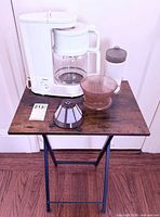 Group shot: coffeemaker, grinder, dripper set, folding table