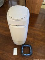Full view of Litter Genie pail with separate refill ring and scale reference tag