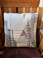 Front view of Frank Lloyd Wright tapestry pillow showing geometric pattern