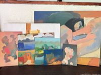 Group shot of all seven paintings showing relative sizes, subjects and condition