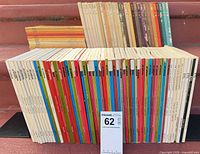 Front view of about 60 ETC magazine spines showing colours and issue numbers