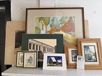 Group shot of all eight artworks on shelf