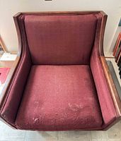 Front view of armchair showing upholstery and frame