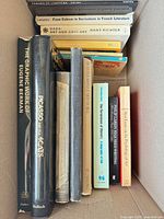 Box 1 showing artist monographs including Tamara de Lempicka, Picasso, Eugene Berman, Dada and Surrealism texts