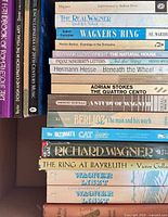 Stack of music, architecture and literature titles with multiple Wagner volumes, Berlioz biography, Frank Lloyd Wright book