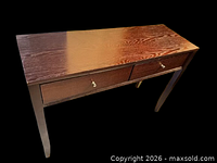 Full view of dark brown two-drawer desk