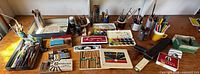 Overhead view of entire lot on workbench showing all art supplies