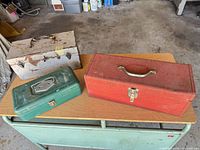 Three toolboxes closed showing exterior colors and sizes