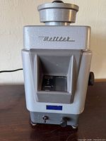 Front view of Mettler K7T scale showing brand script and control panel