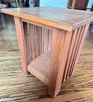 Full view of mission oak end table showing top, slatted sides, lower shelf