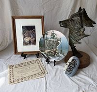 Group shot showing all four wolf-themed items and COA
